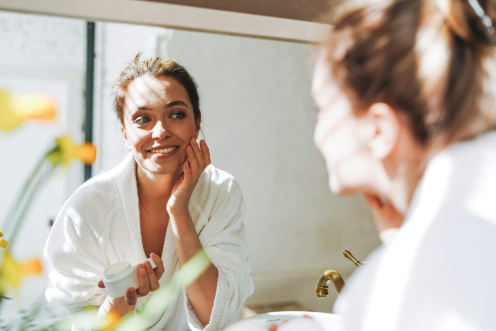 sprucemd woman looking in mirror